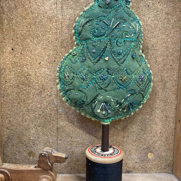 Green tree with French embroidery detail 