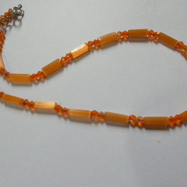 Vibrant orange cats eye and crystal bead single strand necklace