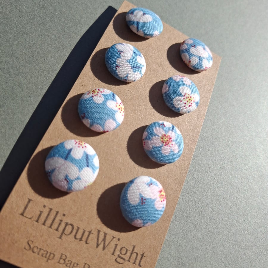 Set of eight scrap bag buttons - white and pink blossom design on blue sky