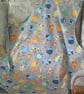 Adult Apron with Multi Coloured Sheep on a Grey Background