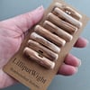 Set of eight driftwood toggle buttons with single hole