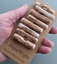 Set of eight driftwood toggle buttons with single hole