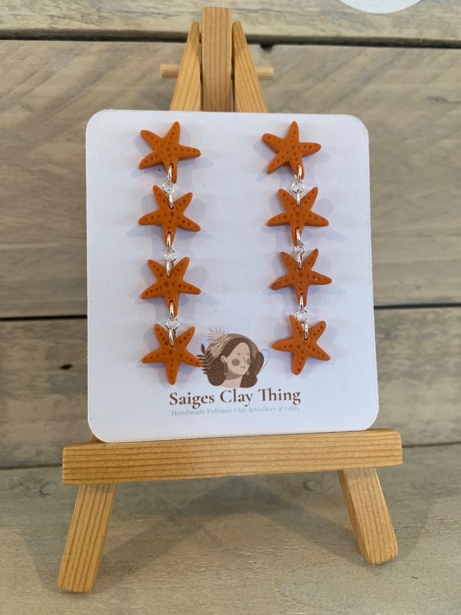 Orange Star Fish Dangle earrings. 