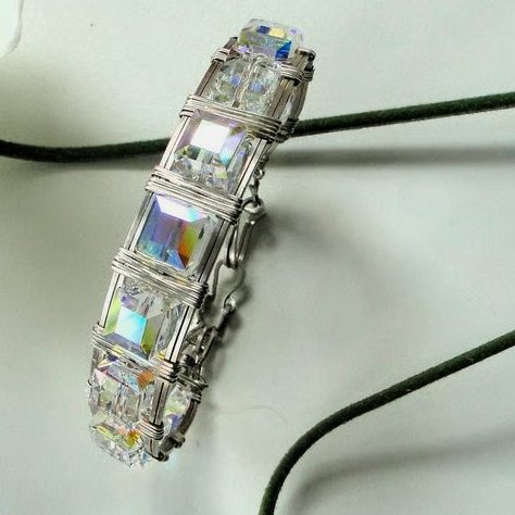 A stunning wire wrapped Chrystal bracelet - Swarovski AB cubes with silver wrap