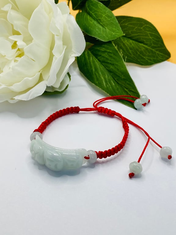 Red macrame bracelet with Burmese jadeite flower carving