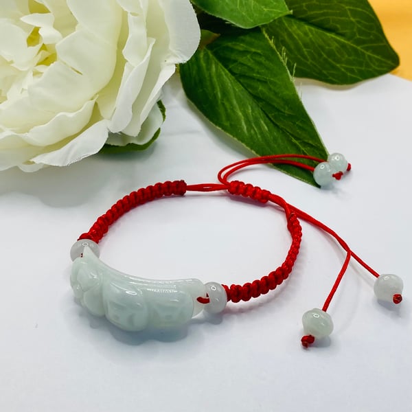 Red macrame bracelet with Burmese jadeite flower carving