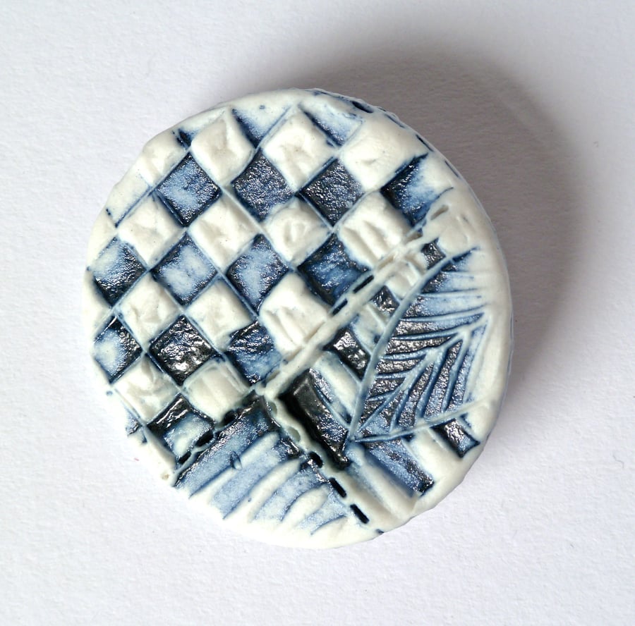  A unique stamped porcelain brooch, hand made in Winchester