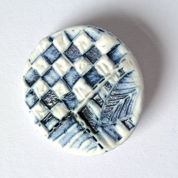  A unique stamped porcelain brooch, hand made in Winchester