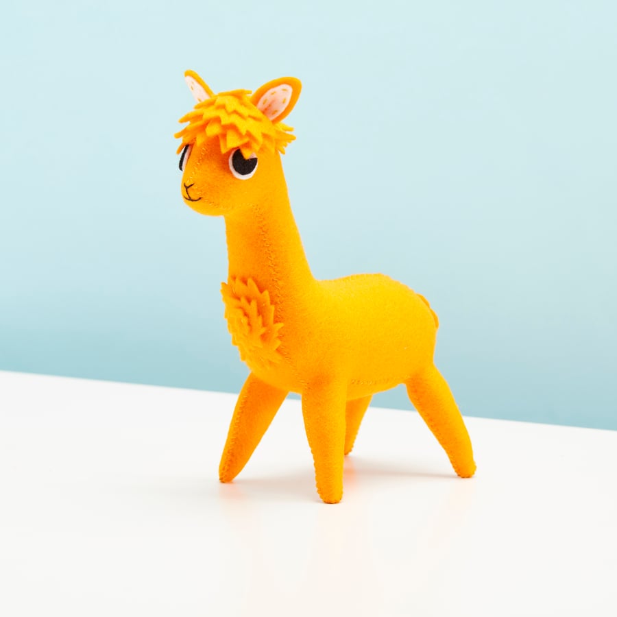 Bright orange Alpaca soft sculpture