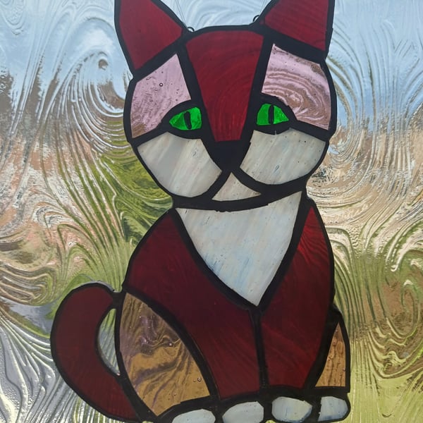 Dark red and pink and white stained glass cat sun-catcher