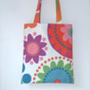 Brightly coloured tote bag with long handles