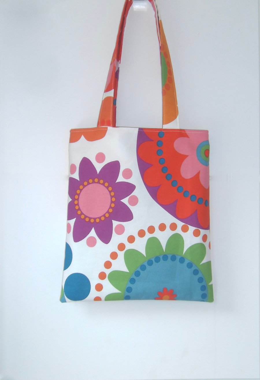 Brightly coloured tote bag with long handles