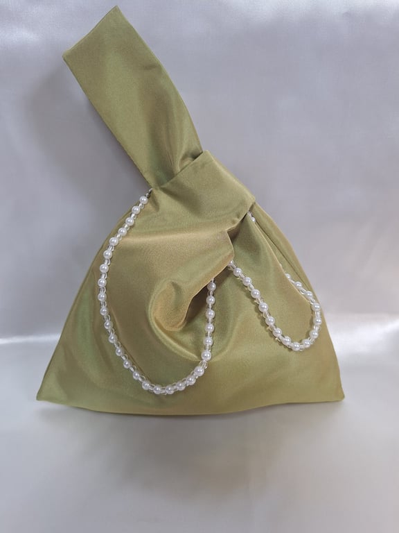 Olive green taffeta Japanese knot bag with pearl detailing.