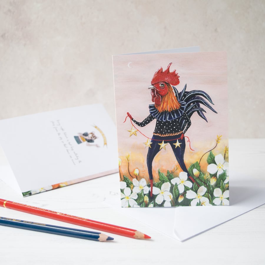 Rooster collecting stars at dawn greeting note card. Blank inside. Unisex card