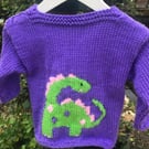 Hand knitted traditional baby cardigan ,purple dinosaurs. Girly 18 months
