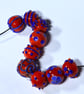 Handmade orange and blue lamp work glass beads - Image 9