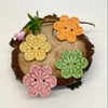Set of four flower shaped ceramic handmade buttons brights