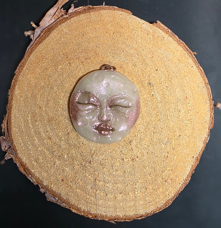 Hand sculpted moon face pendant