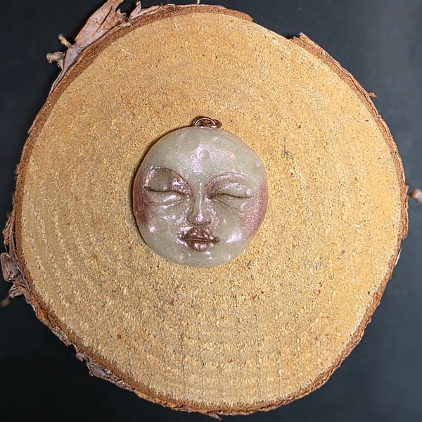 Hand sculpted moon face pendant