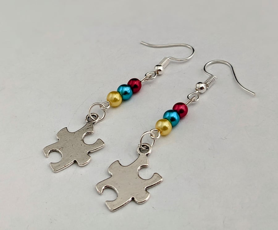 Multi coloured earrings with jigsaw charms