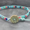 Teal leather bracelet with coral, blue and teal glass beads with wooden button 