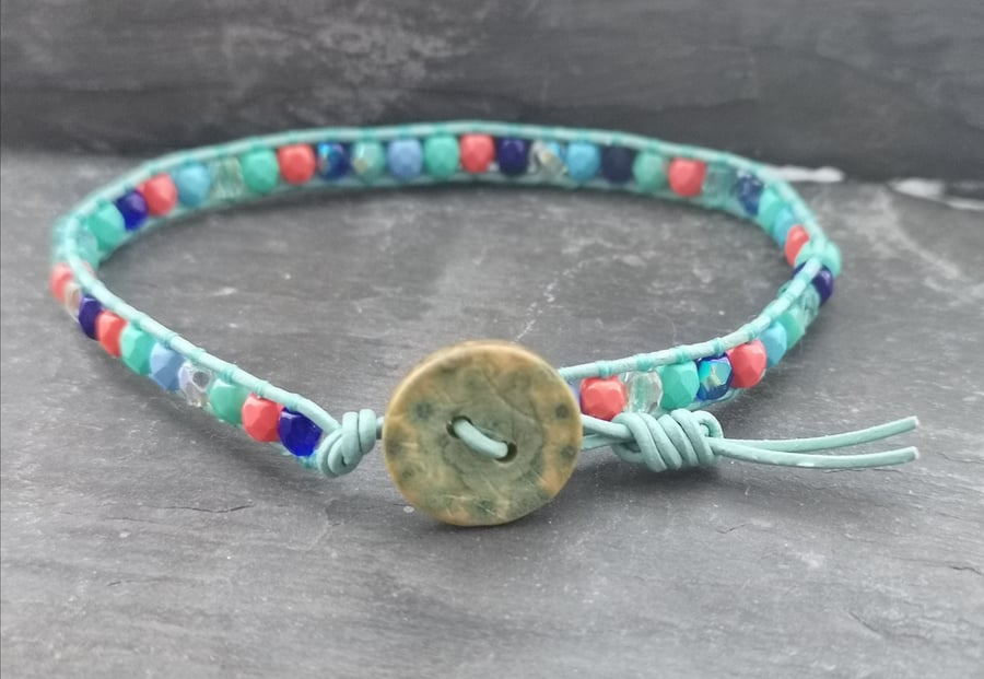 Teal leather bracelet with coral, blue and teal glass beads with wooden button 