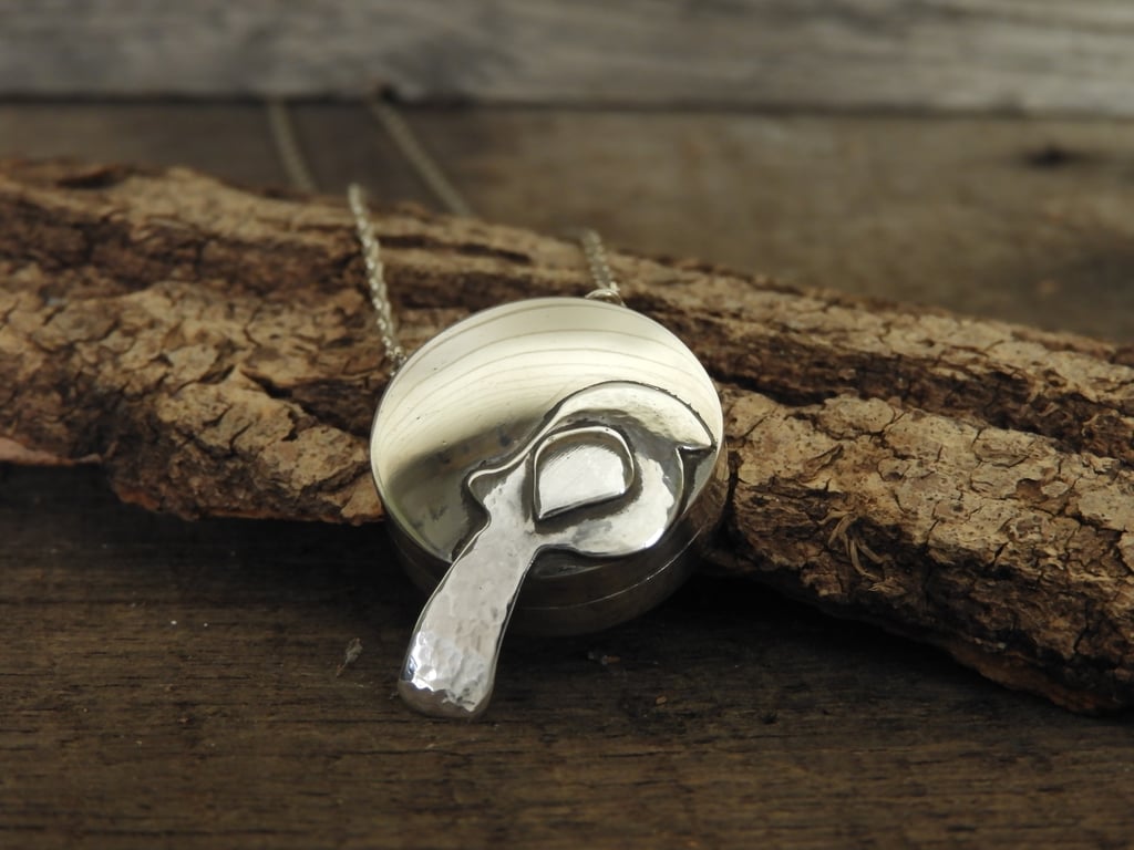 Sterling silver locket with bird motif