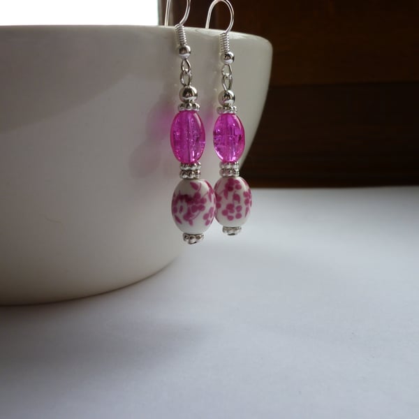 DEEP PINK, WHITE AND SILVER FLORAL CERAMIC DANGLE EARRINGS.