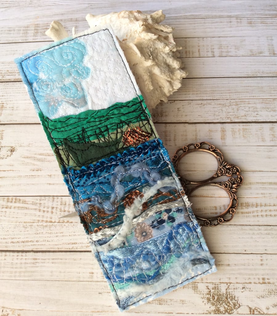 Embroidered seascape bookmark.