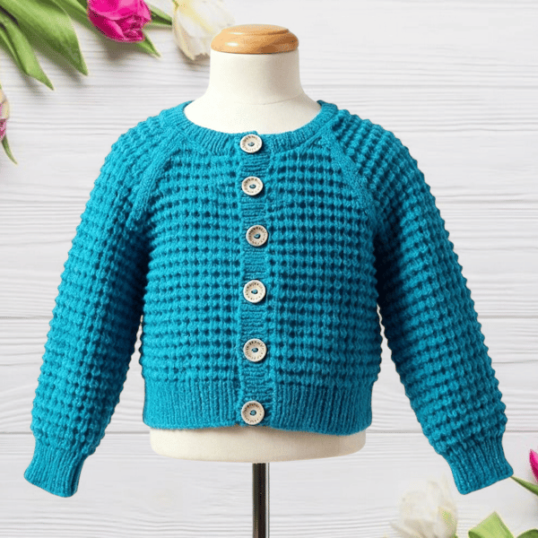 Hand knitted baby cardigan in turquoise with textured pattern 