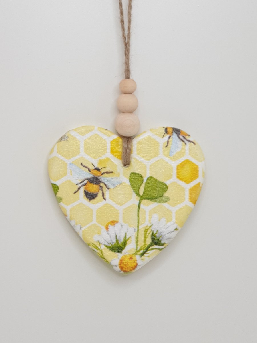 Clay heart hanging decoration decoupaged with bees  