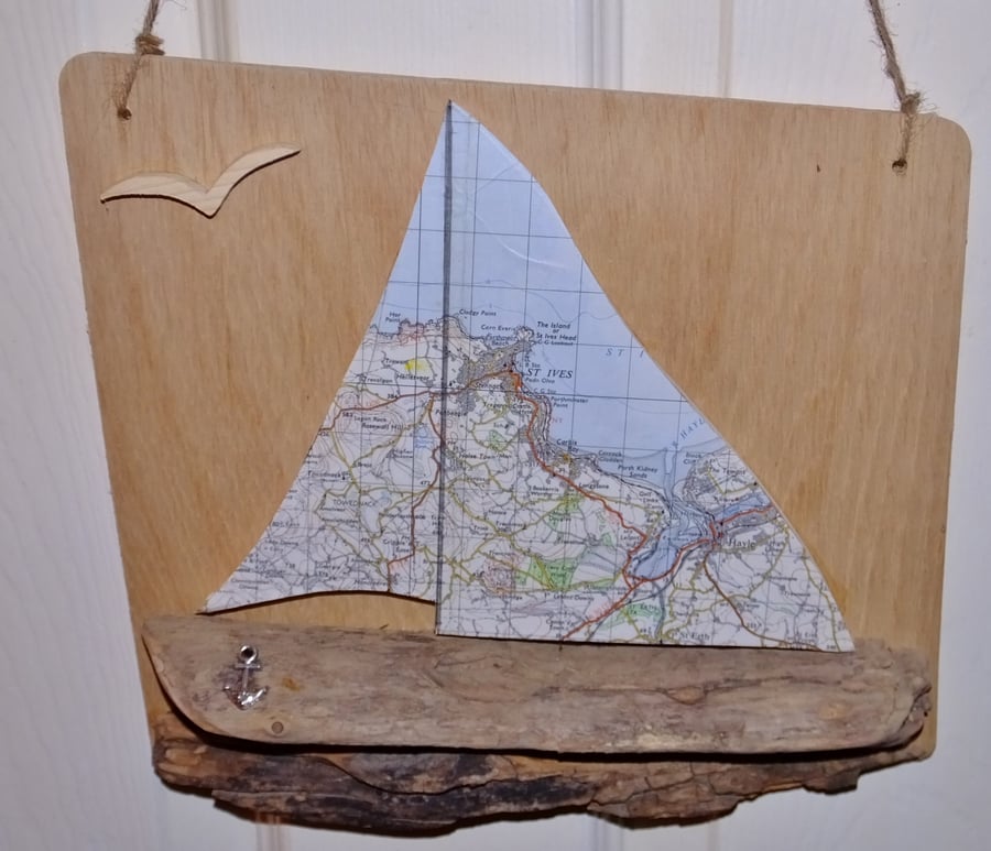 Driftwood yatch or sailing boat with Ordnance Survey sails of St. Ives & Hayle 