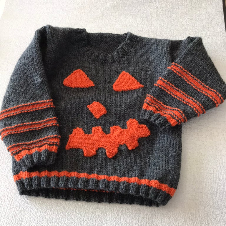 Pumpkin face jumper for a toddler