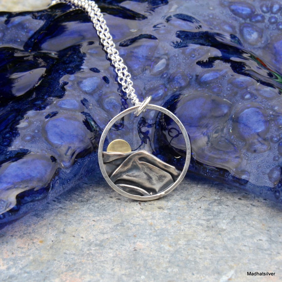 Silver sun rising over mountains hills pendant