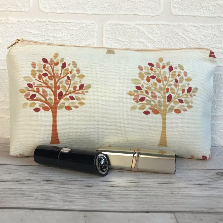 Cosmetic bag, make up bag in cream with trees pattern in Autumn colours