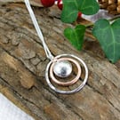 Circles Necklace. Recycled Sterling Silver Pebble with Copper Fidget Pendant