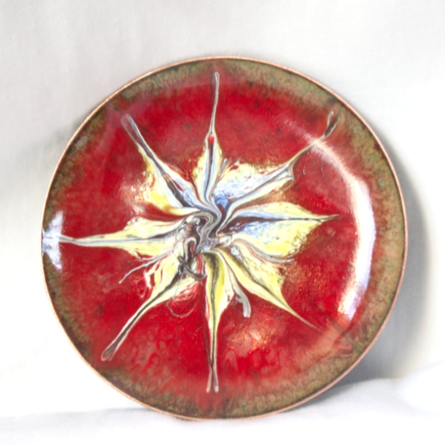 enamelled dish: scrolled white, gold and blue on red over clear