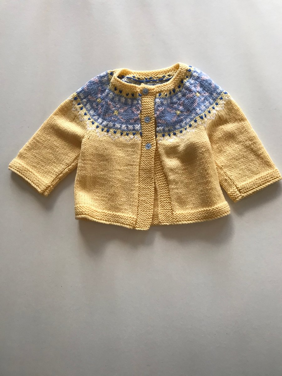 Hand knitted baby cardigan with a fair isle yoke