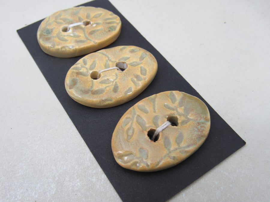 3 Medium Oval Old Gold Leaf Pattern Ceramic Buttons