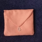 Clutch bag in peach. Purse, small handbag, pouch. Evening or wedding accessory