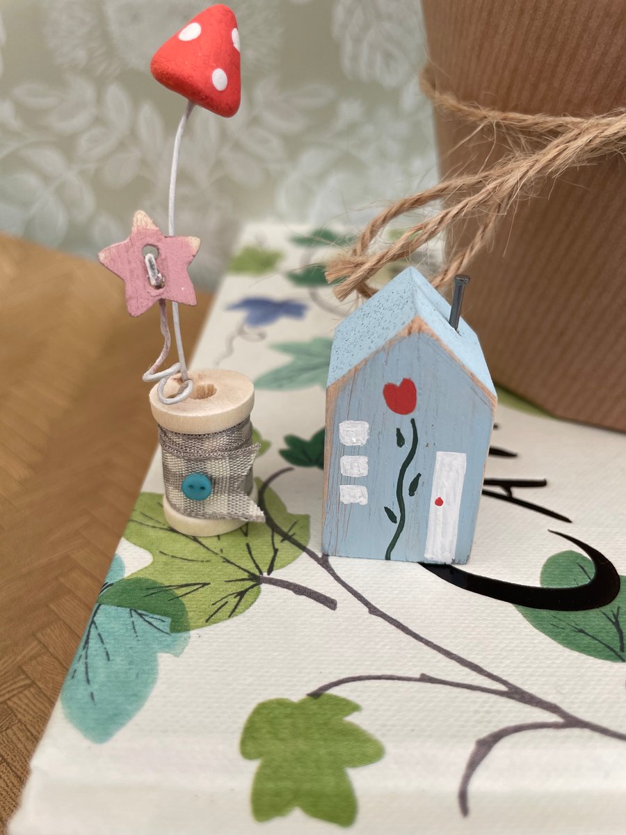 Teeny miniature wooden house and cotton reel