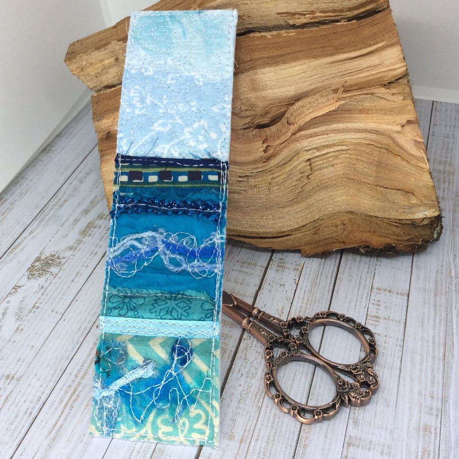 Up-cycled embroidered seascape bookmark. 