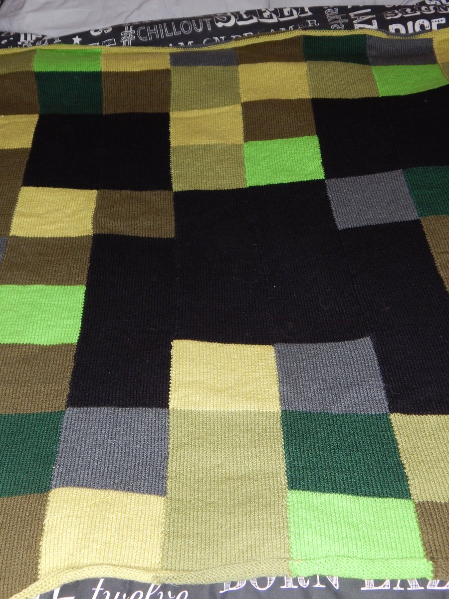 Video game inspired child's hand knit blanket