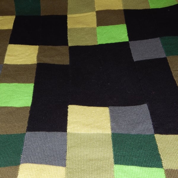 Video game inspired child's hand knit blanket