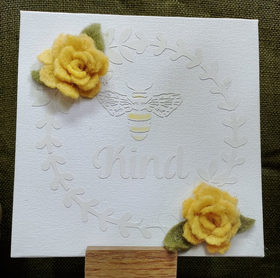 textured canvas with felt flowers