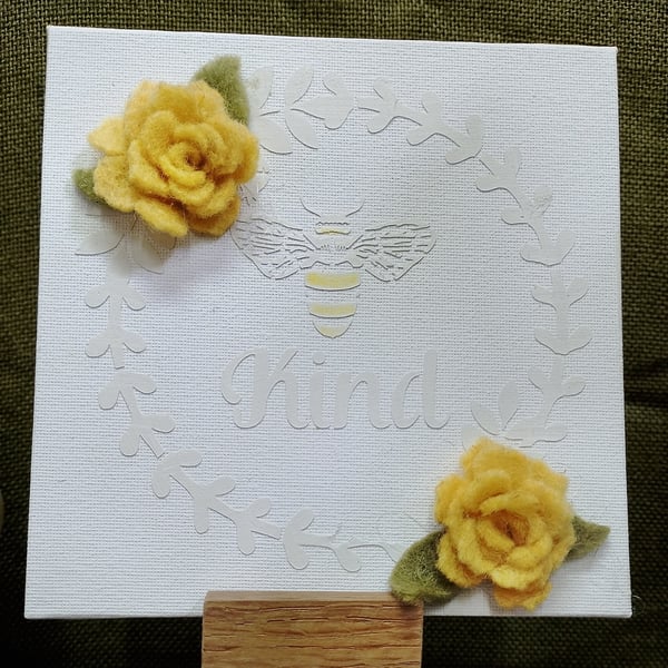 textured canvas with felt flowers
