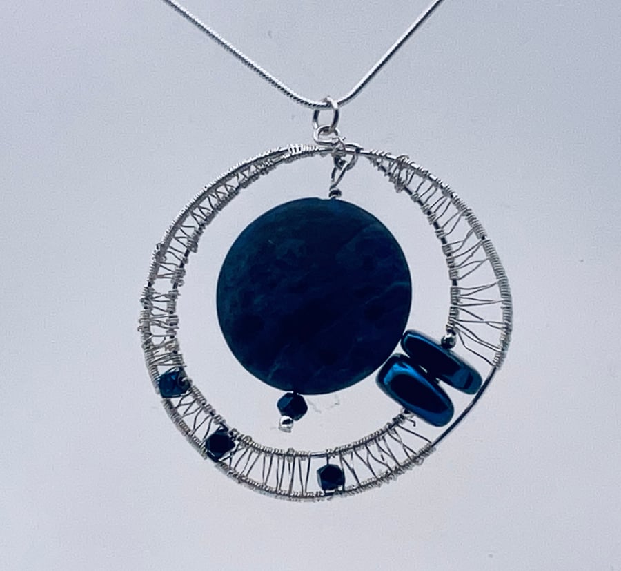  A stunning matte sodalite and sparkliNg blue hematite pendant