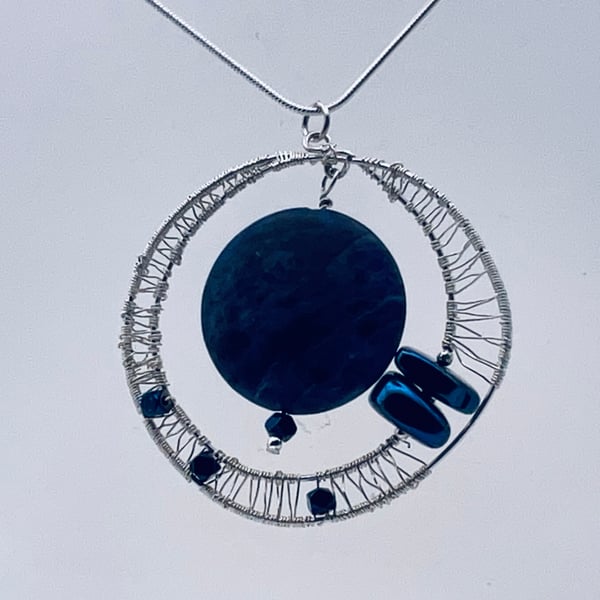  A stunning matte sodalite and sparkliNg blue hematite pendant