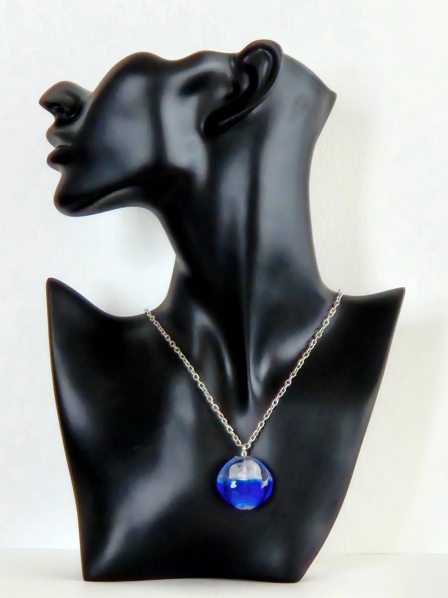  Bright blue glass necklace with embedded silver foil.