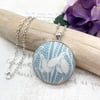 Snowdrop in soft blue fabric button pendant Art Nouveau style antique silver